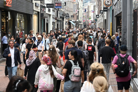 Amsterdam, Netherlands - August 24, 2024: A crowd of people in the street in center of Amsterdam, Netherlands.のeditorial素材
