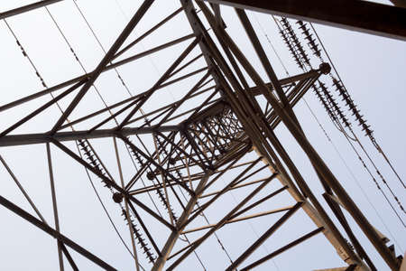 electricity tower overhead power line transmission tower on background blue sky.の写真素材