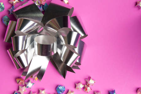 ribbon on gift box on pink background.の写真素材