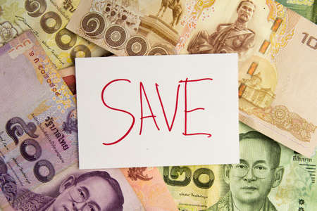 save money for thai on banknotes background.の写真素材