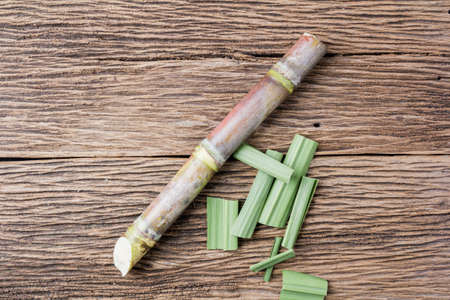 Close up sugarcane on wood background.Top view
