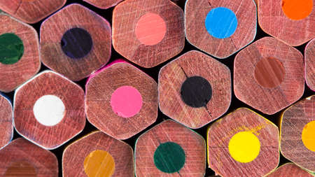 Color pencils on black background close up
