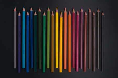 color pencils on black background close up.