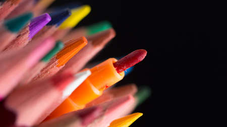 color Pencils success creative concept On Black Background Close-up.