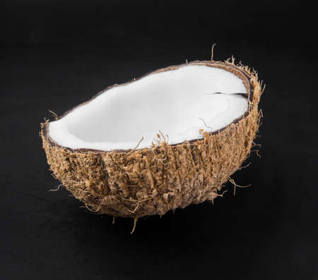 close up coconuts isolated on black background