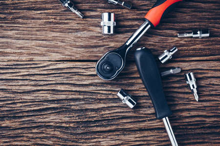 working tools on wooden background. color effect