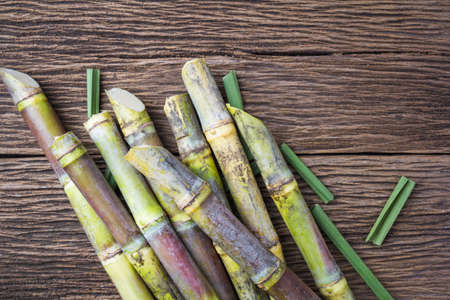 Close up sugarcane on wood background close up.