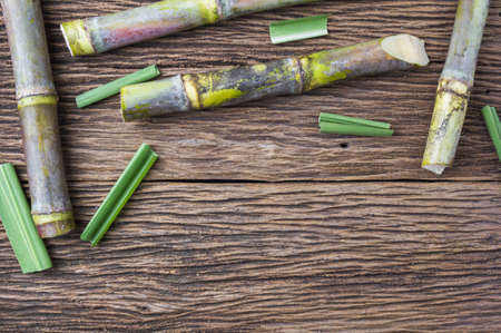 Close up sugarcane on wood background close up.