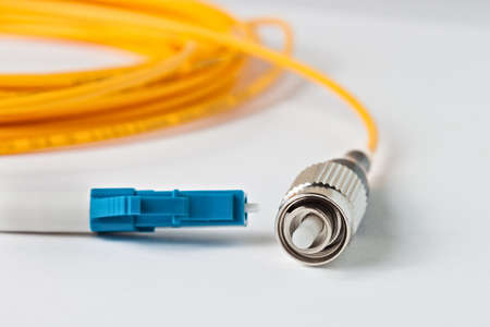 Macro Fiber optic patchcord LC-FC on white background