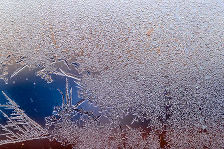 Macro Ice flowers. Frost flowers. Window frost. Winter in the window. Color gradientの写真素材