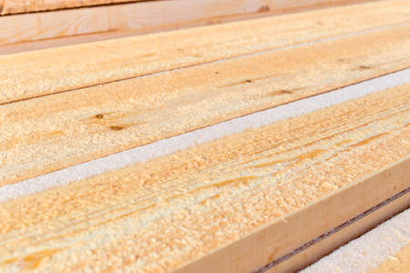 Wooden board for terrace, stacked at construction siteの写真素材