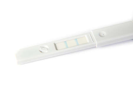 positive pregnancy test on white background, macro
