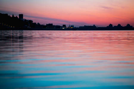 night city on the river on a sky backgroundの写真素材