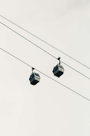 The  Cableway two cabins wire sky backgroundの写真素材