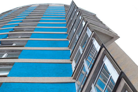 Bottom view of modern glass skyscraper against sky. Business district against sky. Blue Skyscrapers...