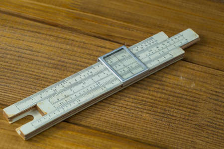 Macro photo, close-up range high-precision hand-held calculating tools - logarithmic ruler brown...
