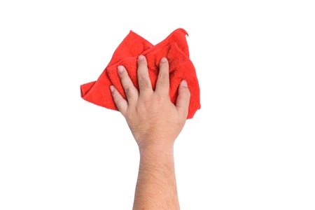 A man's hand Using red rags wipe on white background or isolatedの写真素材
