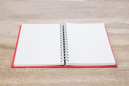 Open diary  or note book on wooden table.の写真素材