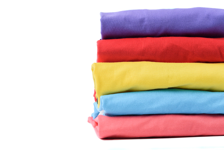 Stack of Colorful cotton T shirt isolated on white background.の写真素材