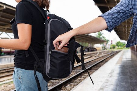 The concept of being careful during travel : Thief was stolen wallet of Asian woman tourists while...