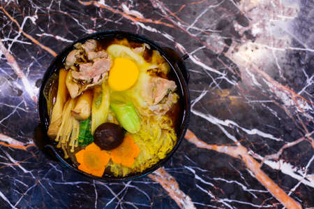 Japanese Food Style : Top view of Homemade pork sukiyaki with eggの写真素材