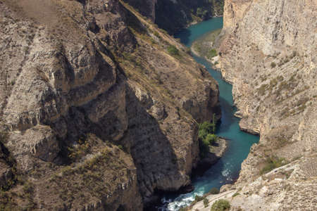 Mountain river water landscape. Wild turquoise river in a mountain gorge. River views from above the canyon, Caucasus mountains, Dagestan, Russia.の写真素材