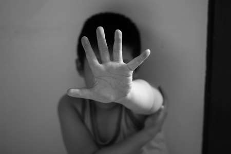 Asian boy raises petition to stop violence conceptの写真素材