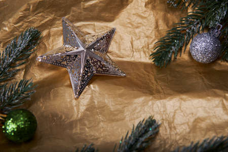 Christmas decoration on golden background. Christmas greeting card with copy space.の写真素材