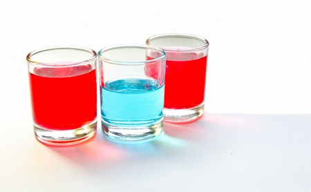 red and blue in the glasses  on white backgroundの写真素材