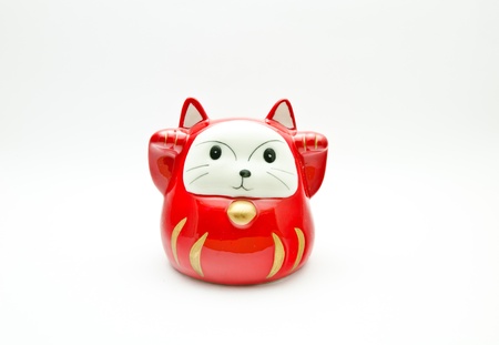 red lucky cat   Maneki Neki  on white background の写真素材