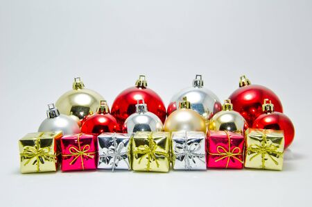 gift boxes and balls on white background の写真素材
