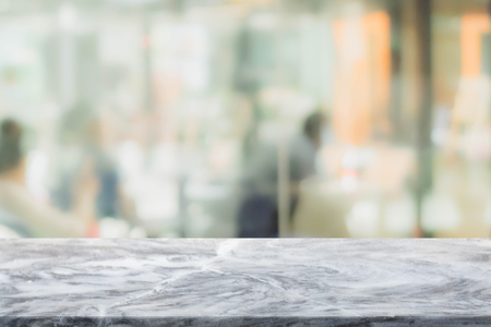 Stone table top and blurred restaurant interior background - can used for display or montage your products.の写真素材