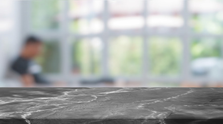Black Stone table top and blurred restaurant interior background - can used for display or montage...