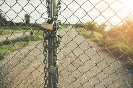 Chain Lock Door outside road background with vintage filter