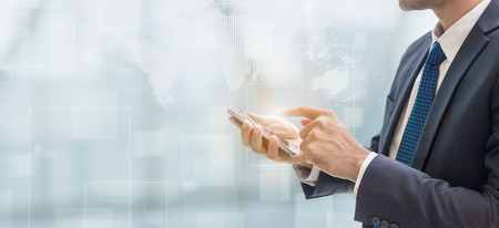 Business man using smart phone on interior space with futuristic technology connection shape over the network connection backgroundの写真素材