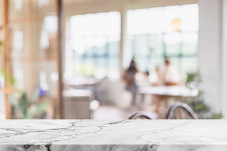 Empty white marble stone table top and blur glass window interior cafe and restaurant banner mock up abstract background - can used for display or montage your products.の写真素材