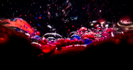 Bubble ink swirling in waterの写真素材