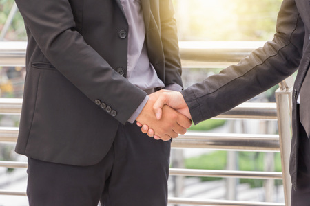 Success and Happiness concept, Business man handshake at city outside office.の写真素材