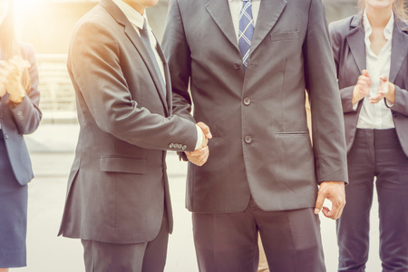 Success and Happiness concept, Business man handshake at city outside office.の写真素材