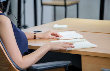 Customer service executive team meeting at office, woman telephone operator with headset wear...