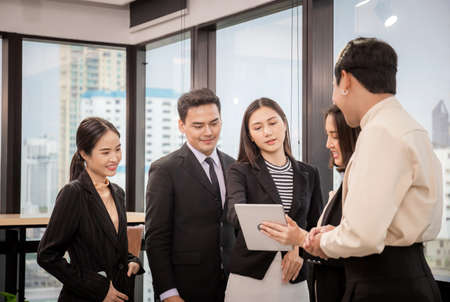 Success and Teamwork concept, Group of young business people meeting in officeの写真素材