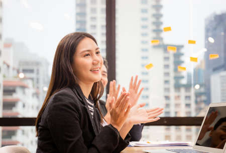 Success and Teamwork concept, Group of young business team meeting, Happy group of business people clapping in officeの写真素材