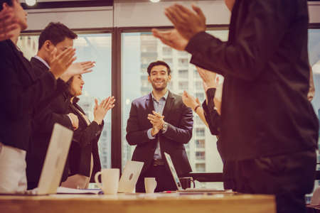 Successful team of young perspective business people in office, business group celebrating after meeting, Success and teamwork conceptの写真素材