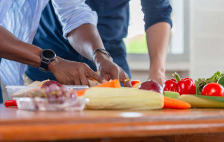 Gay couple homosexual cooking together at kitchen, LGBT conceptの写真素材