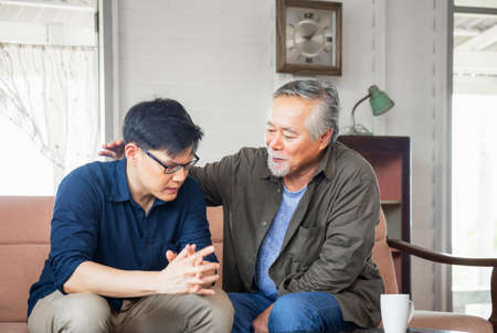 Senior asian father give advice adult son in living room, Happiness family concepts