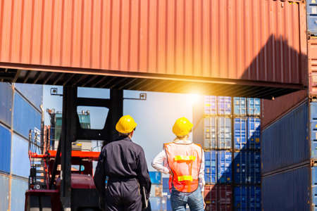Engineer and worker team checking containers box from cargo, Logistic and teamwork conceptの写真素材