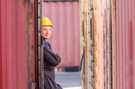 Funny factory worker man smiling with arms crossed and looking at camera