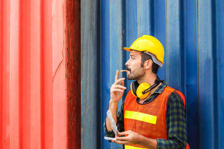 Worker with a cigarette smoke break, Labour takes a cigarette breakの写真素材