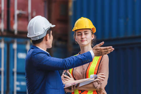 Engineer and worker team checking containers box from cargo, Logistic and teamwork conceptの写真素材