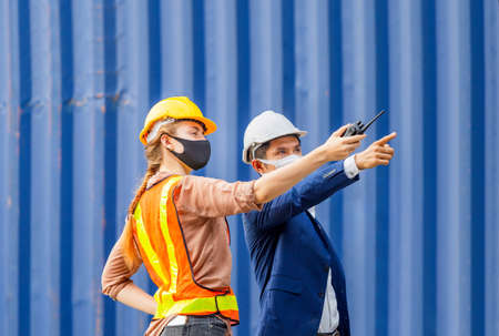 Engineer and worker team checking containers box from cargo, Logistic and teamwork conceptの写真素材